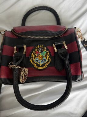 Striped Red and Black Satchel Handbag with Crest Accent